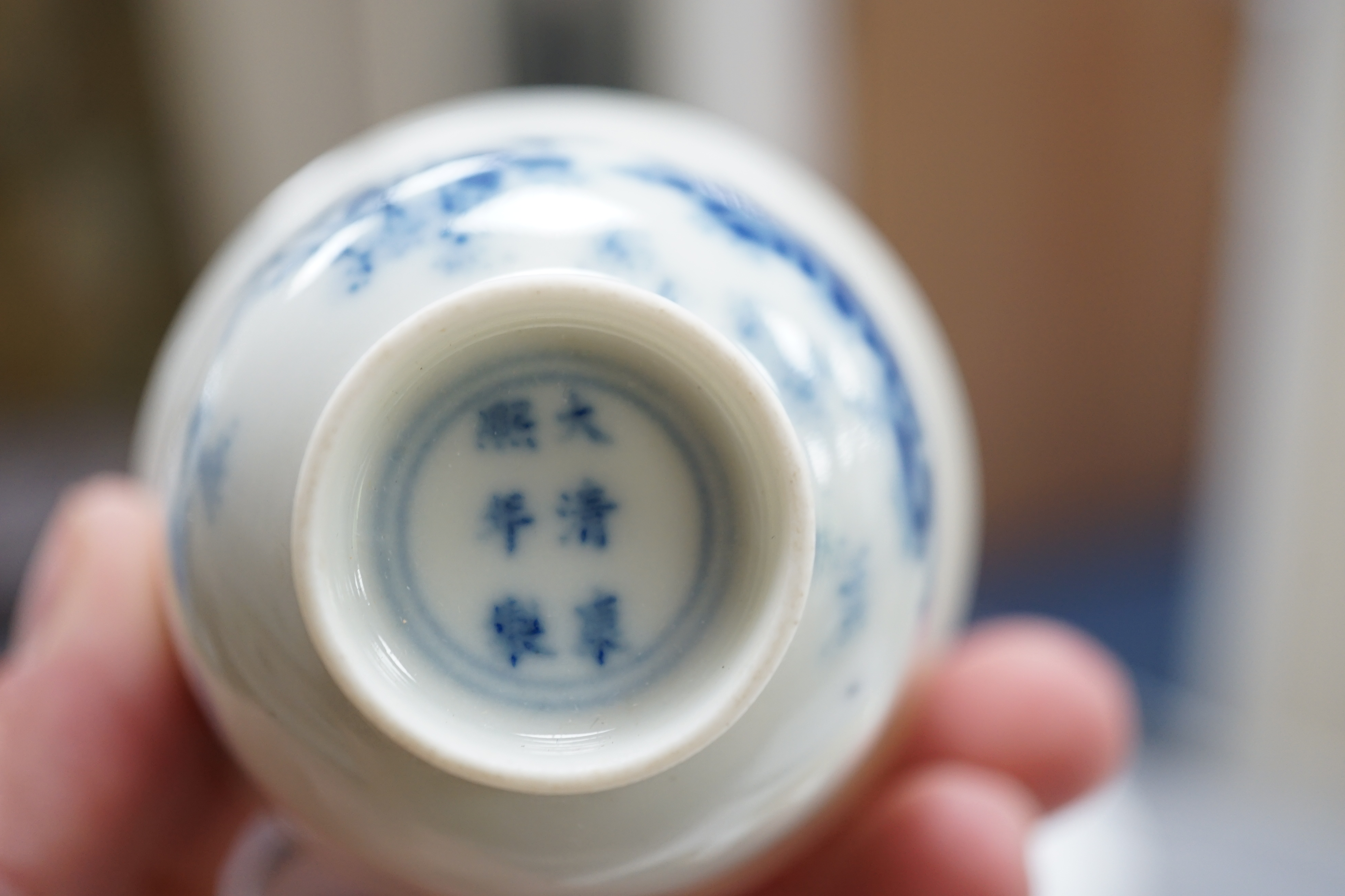 A Chinese blue and white 'month' cup, Kangxi mark, probably late 19th century